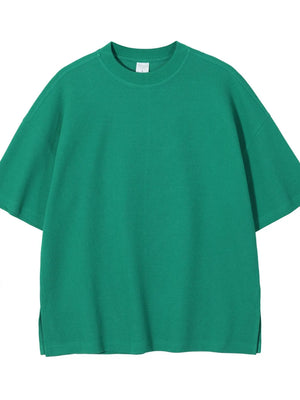 Green waffle knit boxy t-shirt with crew neck and short sleeves.