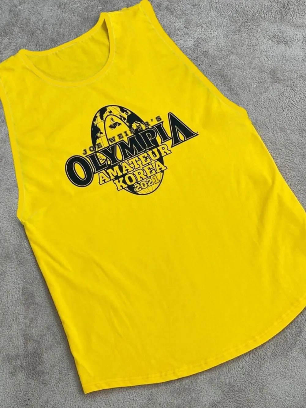 Yellow graphic muscle tank top with Olympia Amateur Korea 2021 print