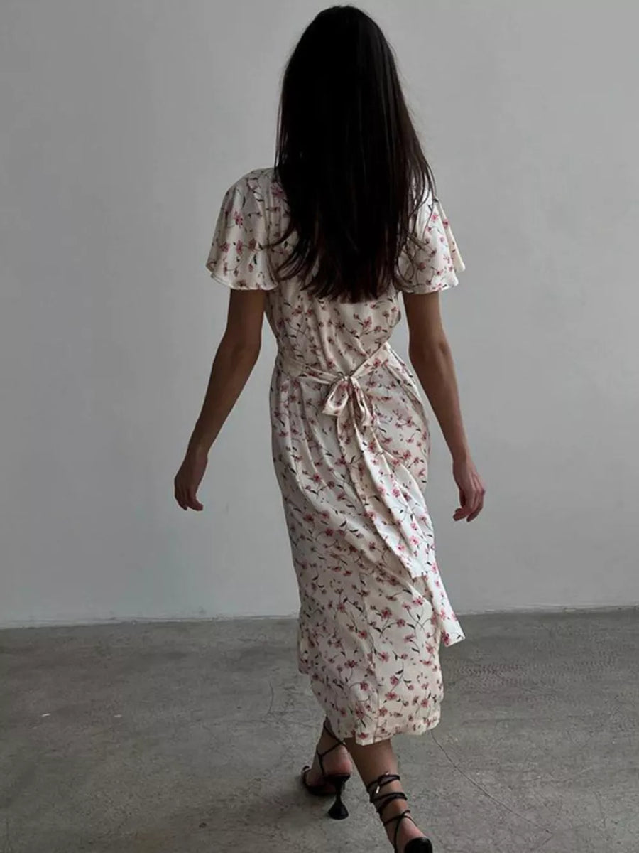 Floral print midi dress with short flutter sleeves and a tie waist.