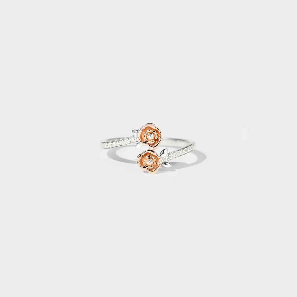 Silver bypass ring with rosebud details and pavé band