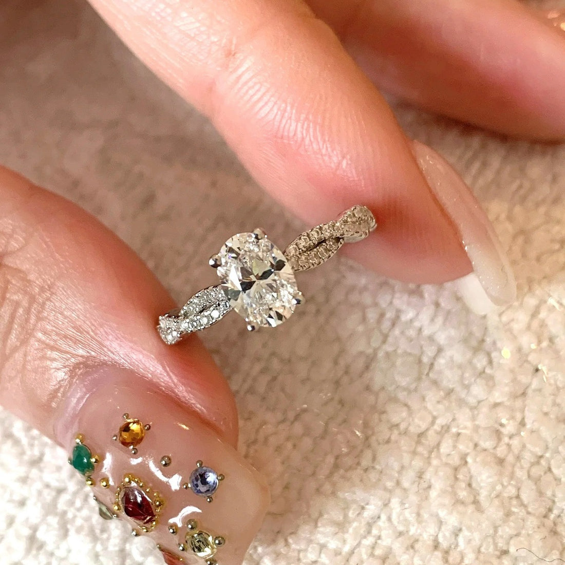 Sterling silver moissanite oval ring with diamond band