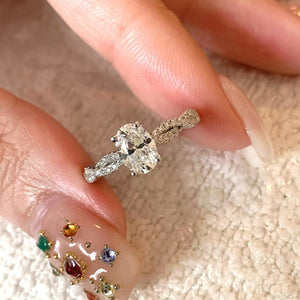 Sterling silver moissanite oval ring with diamond band