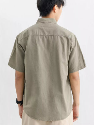 Men's short-sleeve cotton overshirt in Army Green, featuring a classic button-up design and relaxed fit.