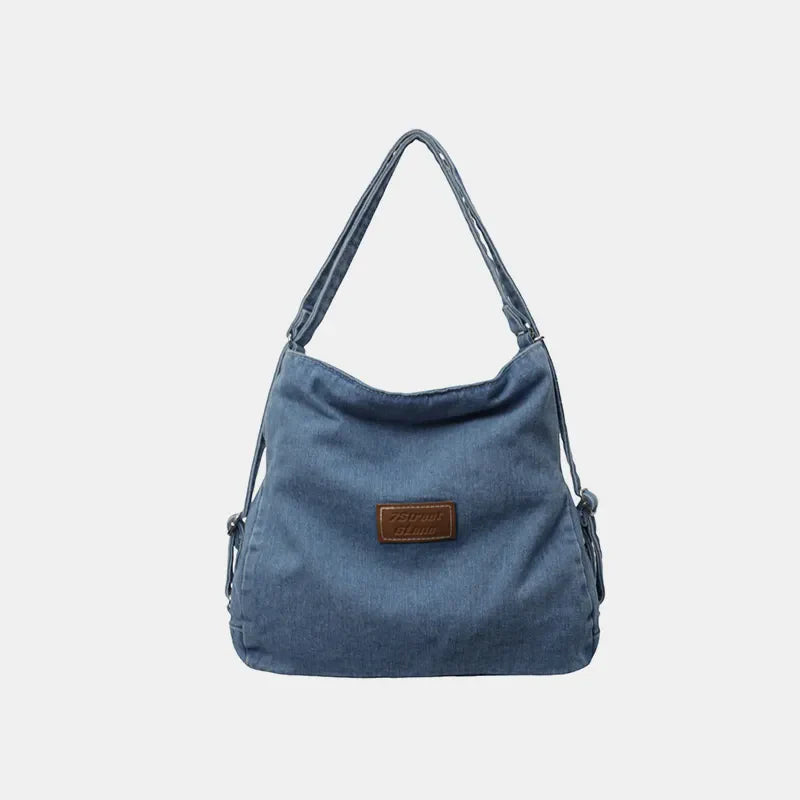 Medium denim hobo bag with leatherette patch and adjustable strap