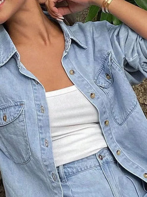 Light blue denim button-up shirt and shorts set with gold buttons and chest pockets.