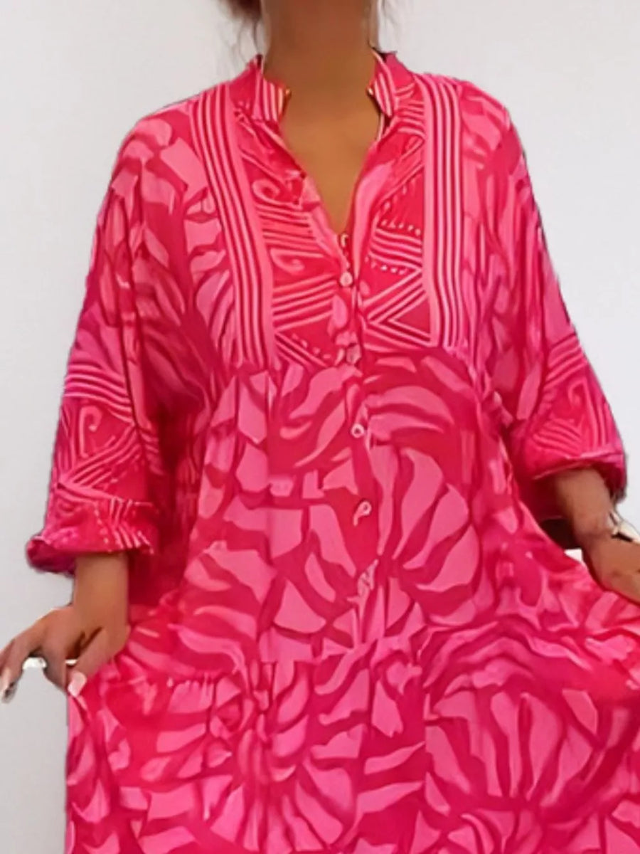 Hot Pink abstract print midi dress with button front and tiered skirt.
