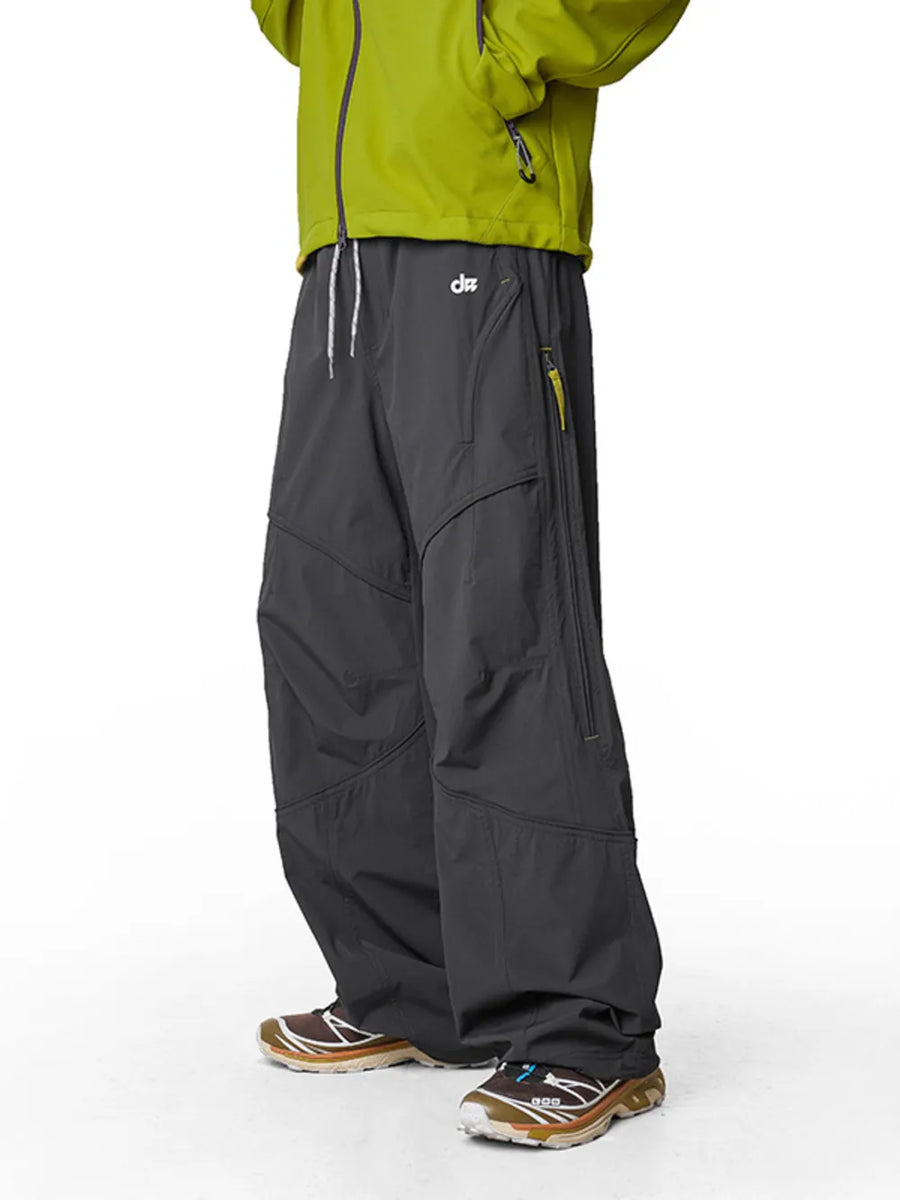 Relaxed graphite gray cargo active pants with drawstring and zip pockets.