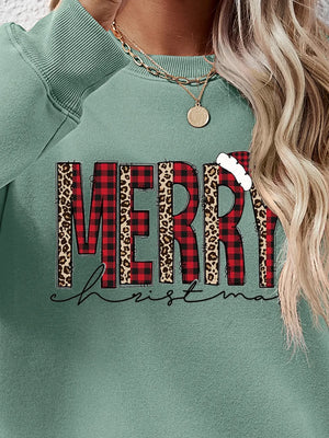 Sage green sweatshirt with "Merry Christmas" graphic in buffalo plaid and leopard print.