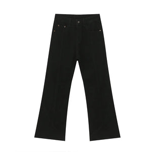 Black denim jeans with panel seams and a flare leg cut.