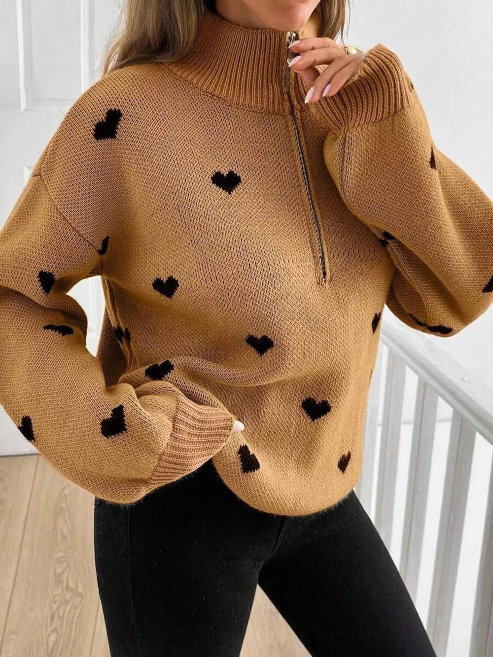 pullover sweater in blush pink with heart-print and ribbed