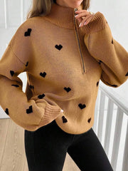 pullover sweater in blush pink with heart-print and ribbed