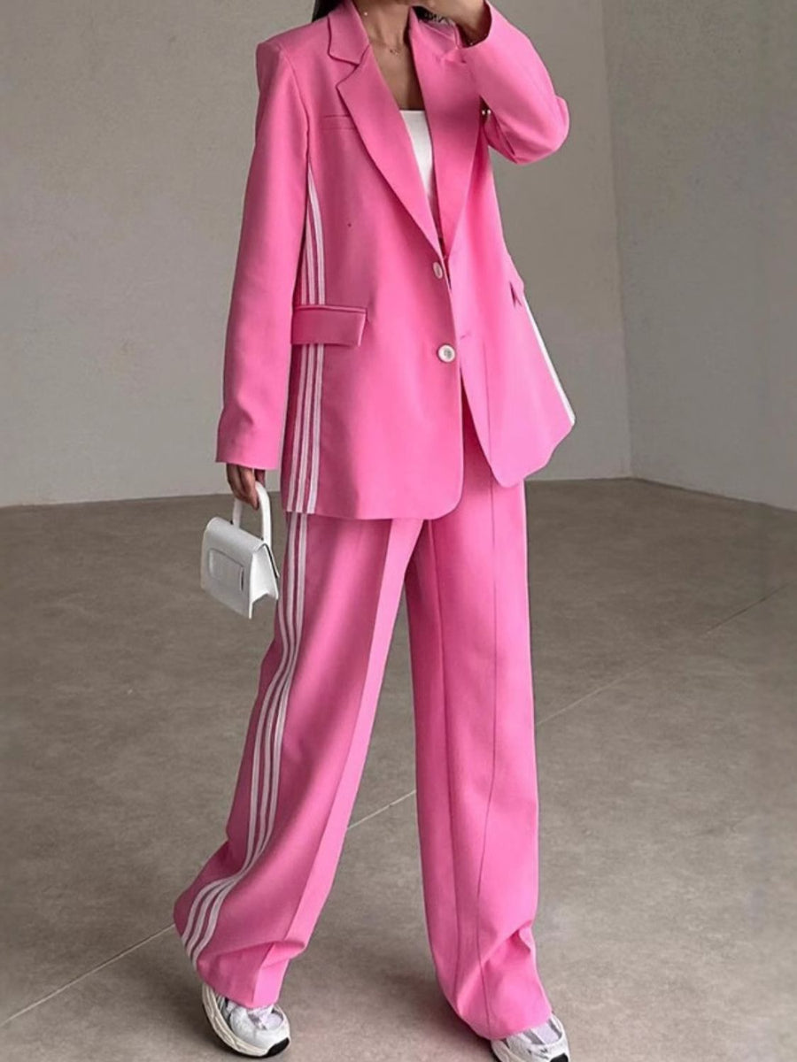 Hot Pink pant suit with white track stripes on blazer and pants.