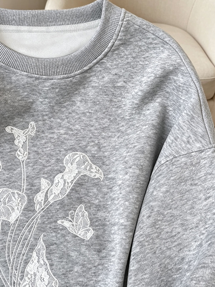 95% polyester, 5% elastane Care instructions: Machine wash cold sweatshirt in heather grey with relaxed silhouette