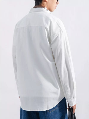 White long sleeve button-up shirt with a relaxed fit, shown from the back.