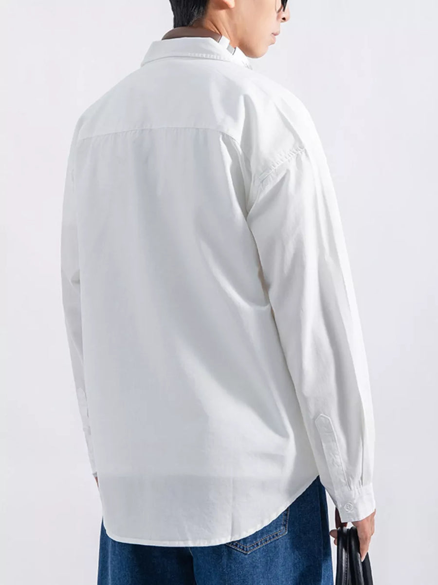 White long sleeve button-up shirt with a relaxed fit, shown from the back.