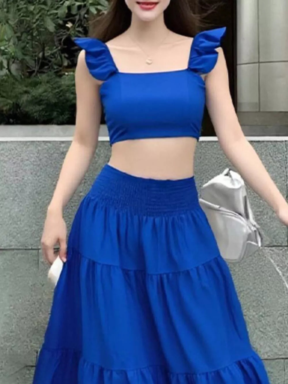 Royal blue ruffled crop top and tiered maxi skirt set with smocked waist