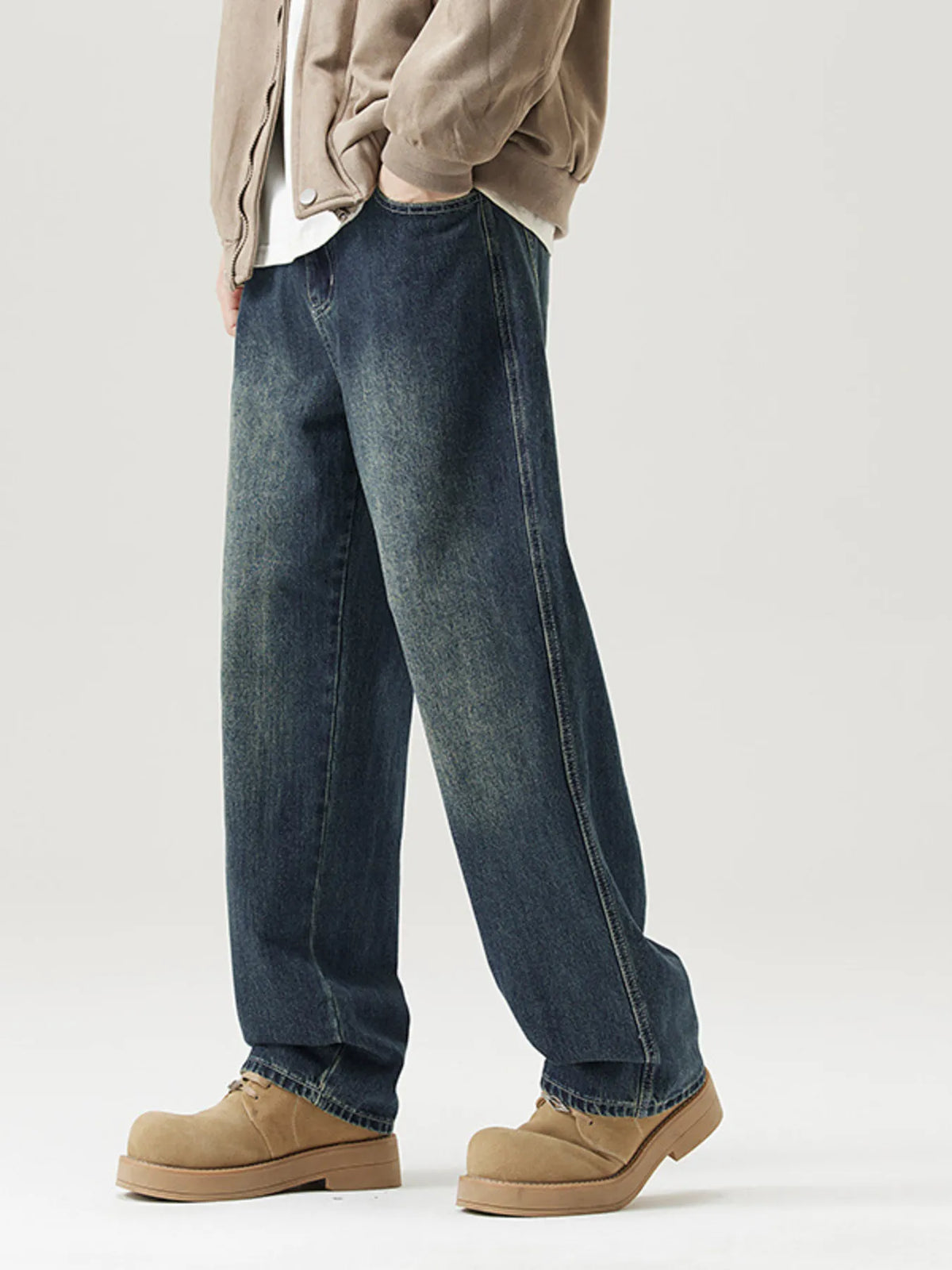 Relaxed fit vintage blue denim jeans with a faded wash and straight leg.