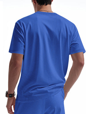 Blue cotton t-shirt with textured fabric and short sleeves, shown from the back.