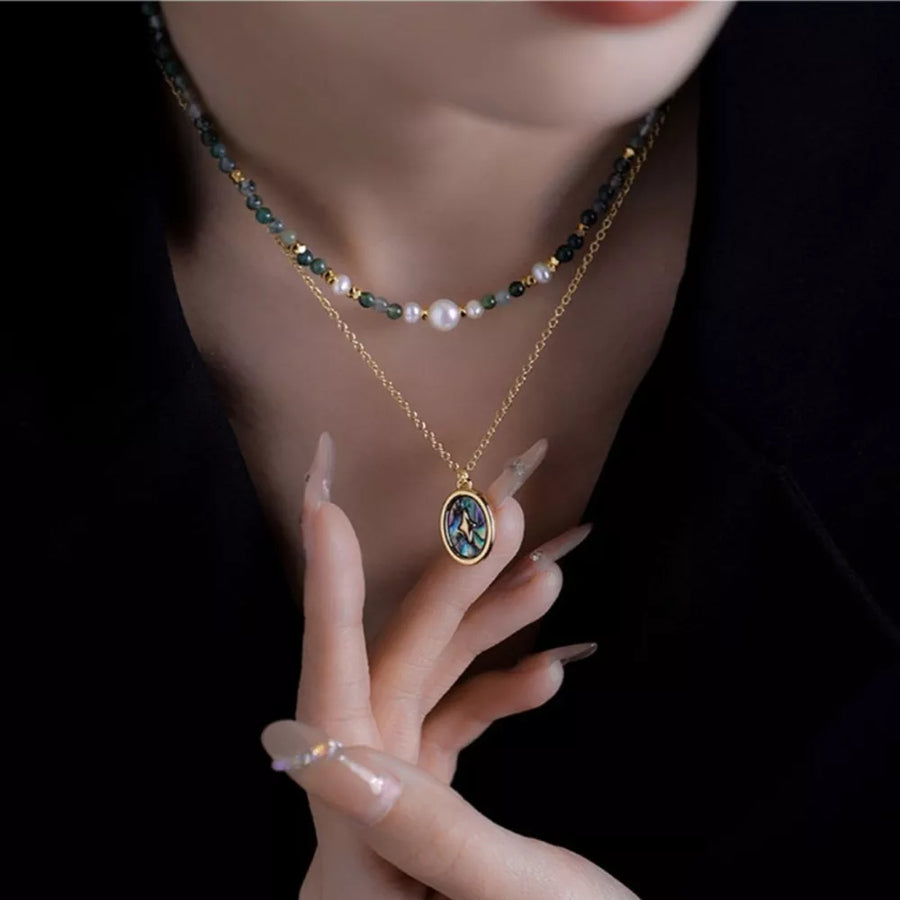 white necklace featuring layered design and organic