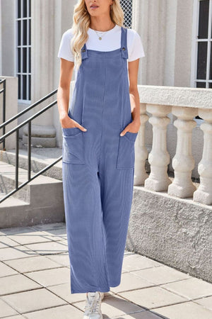 Dusty Blue striped denim overalls with patch pockets and wide legs.