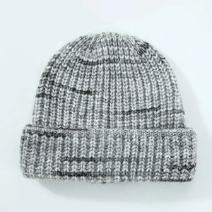 Textured mélange ribbed beanie in gray with dark stripes and a cuffed brim.