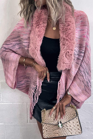 Textured knit cape in Dusty Pink with faux fur collar and fringe detail.