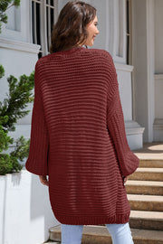 Textured knit cocoon cardigan in maroon with balloon sleeves.