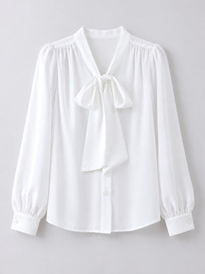 white blouse with hip-length and button-front
