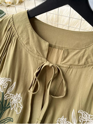 Khaki cotton maxi dress with tie neck and white floral embroidery