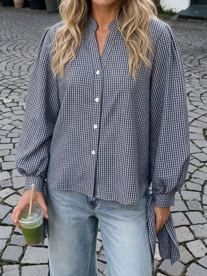 navy blue button-up shirt with hip-length and button-front
