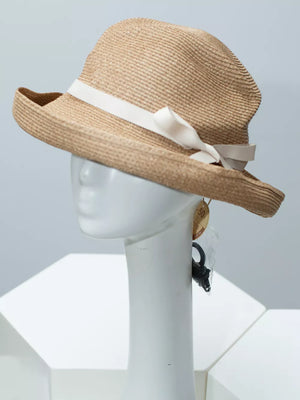 Beige straw sun hat with white ribbon bow detail