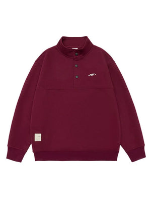 Maroon cotton blend sweatshirt with buttoned neckline and embroidered logo.