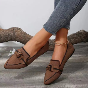 Brown knit bow loafers with contrast trim and pointed toe.