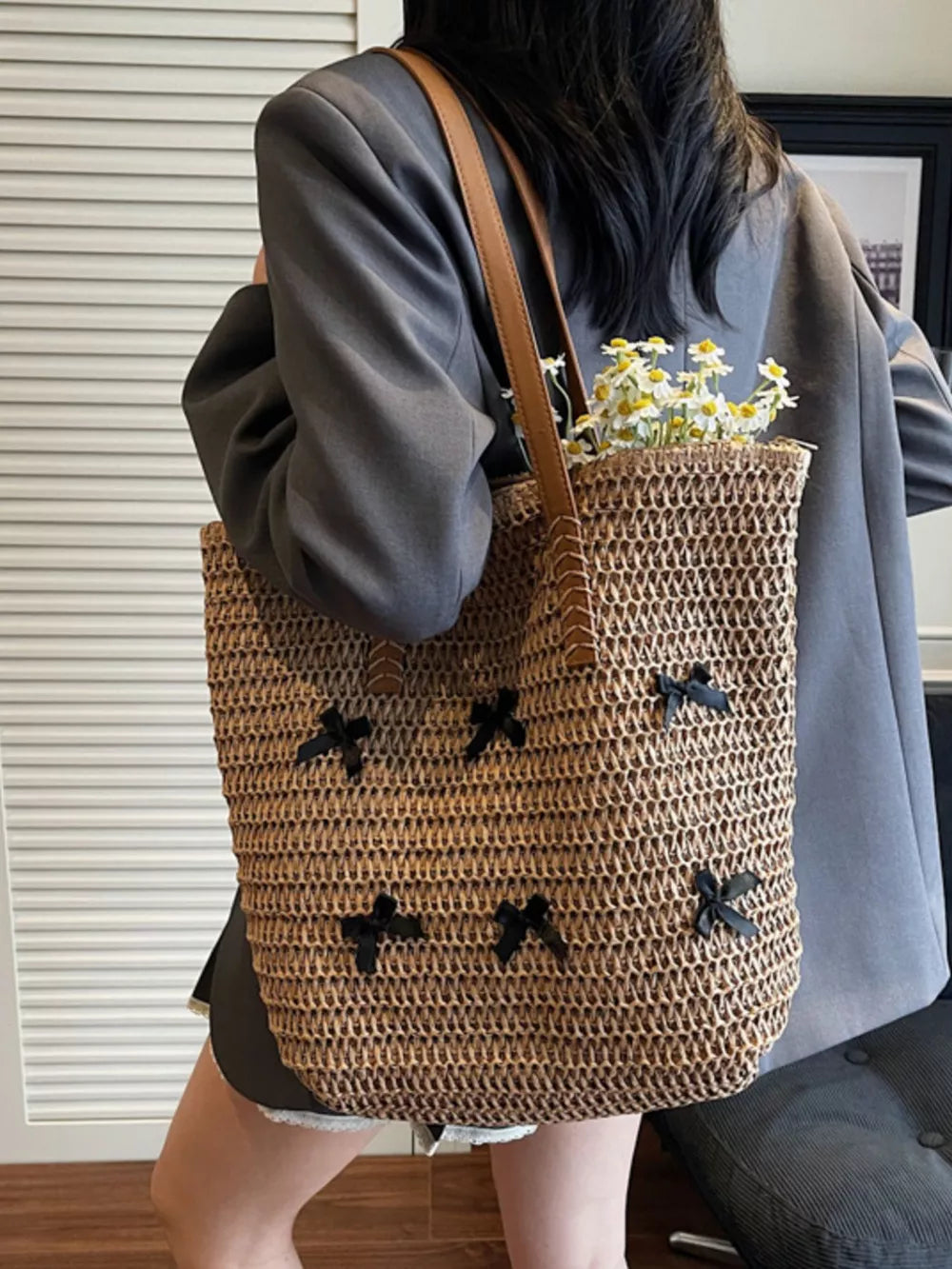 handbag in natural tan featuring woven and tote fit