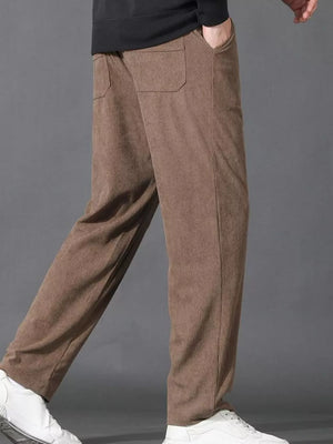 Men's khaki corduroy joggers with drawstring and back pockets.