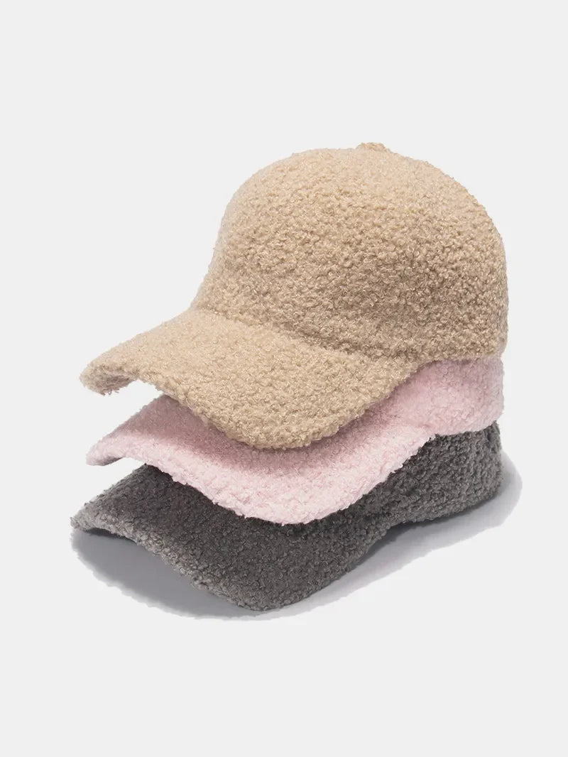 Textured sherpa baseball cap in khaki, pink, and gray.