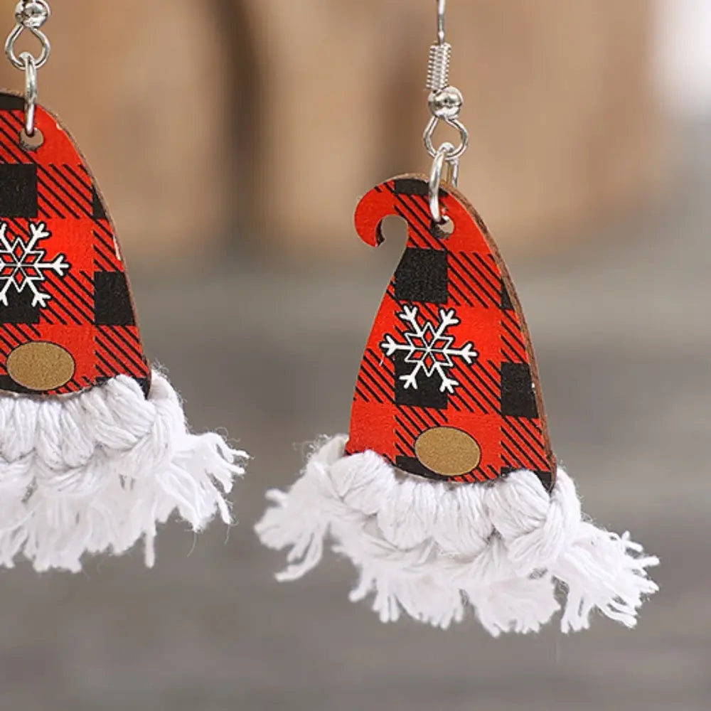 Gnome hat macrame drop earrings in red and black buffalo plaid with white snowflake detail.