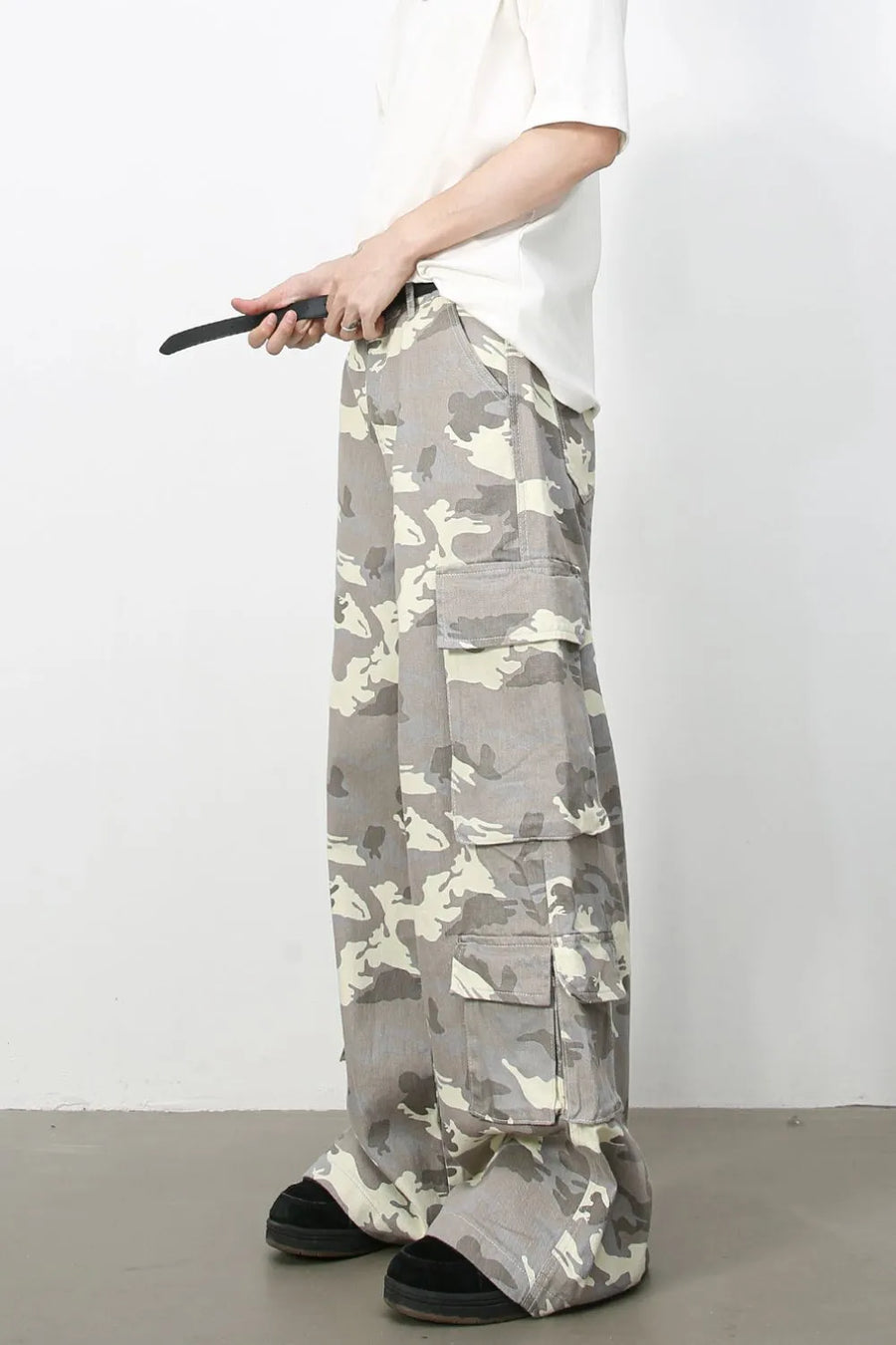 Urban Warrior cargo jeans in gray camouflage with multiple pockets and a relaxed fit.