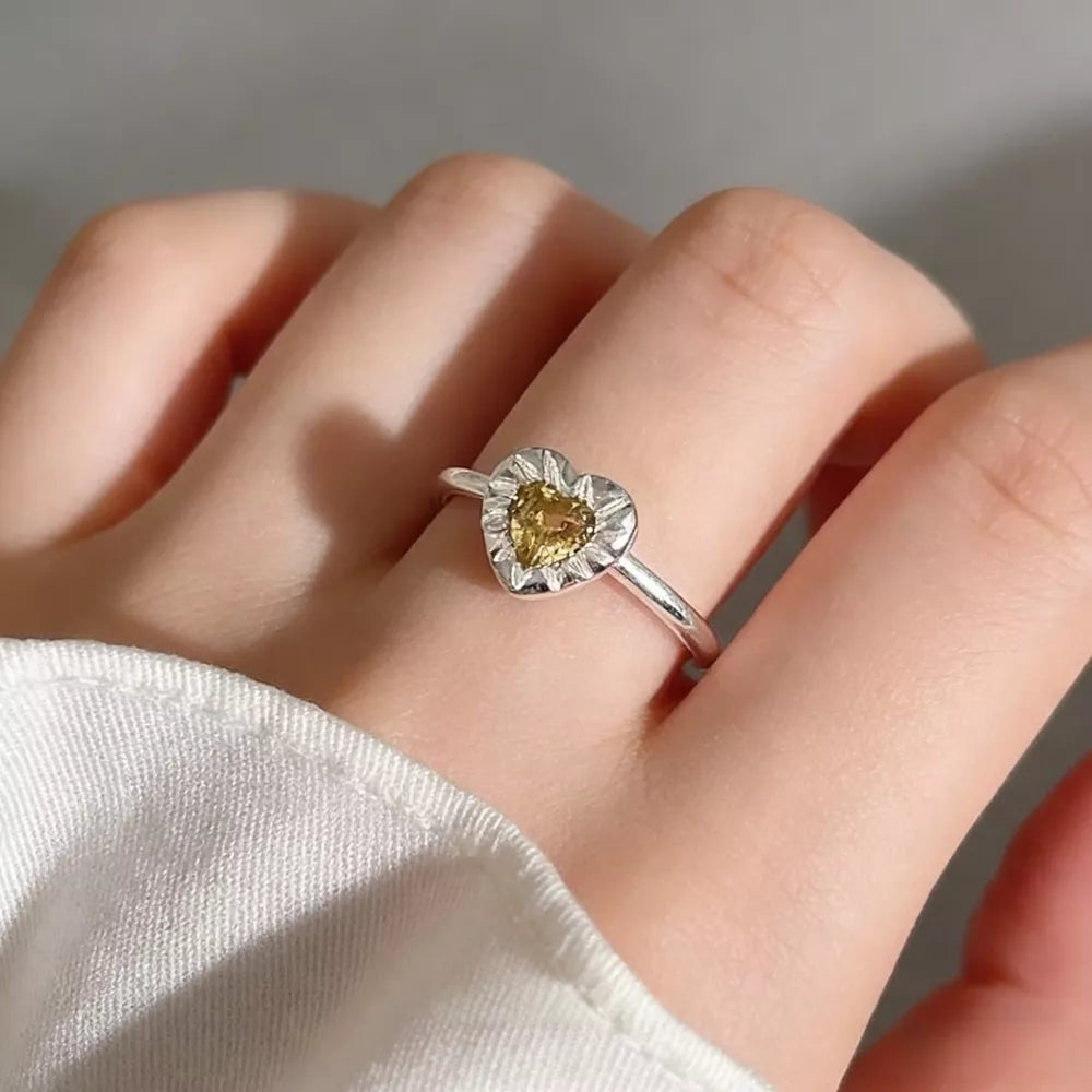 ring in silver featuring heart-shaped stone and fitted fit