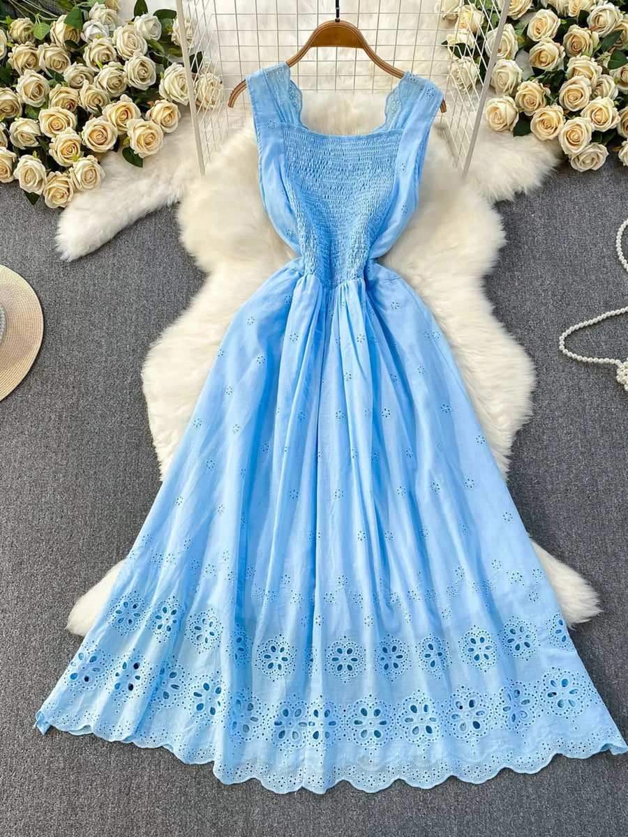 Blue eyelet maxi dress with smocked bodice and cutout detail
