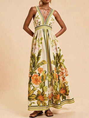 Maxi dress with tropical leaf and parrot print, V-neck, and striped trim.