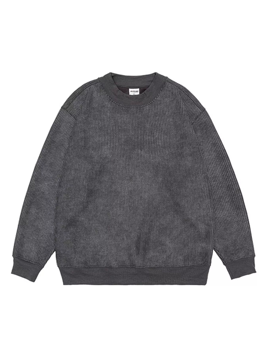 Dark gray oversized corduroy sweatshirt with round neck and ribbed cuffs and hem.