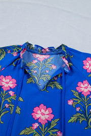 Blue cotton tiered floral dress with V-neck and tie detail