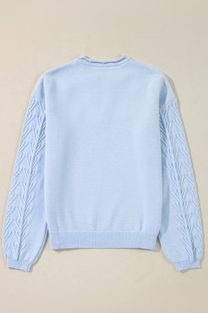 Light blue sweater with cable knit sleeves and crew neck