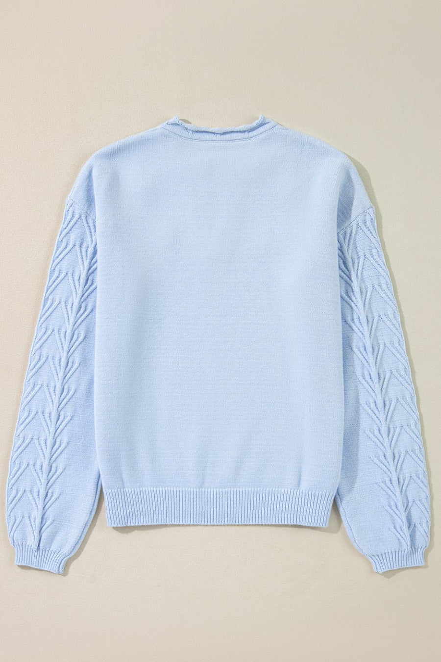 Light blue sweater with cable knit sleeves and crew neck