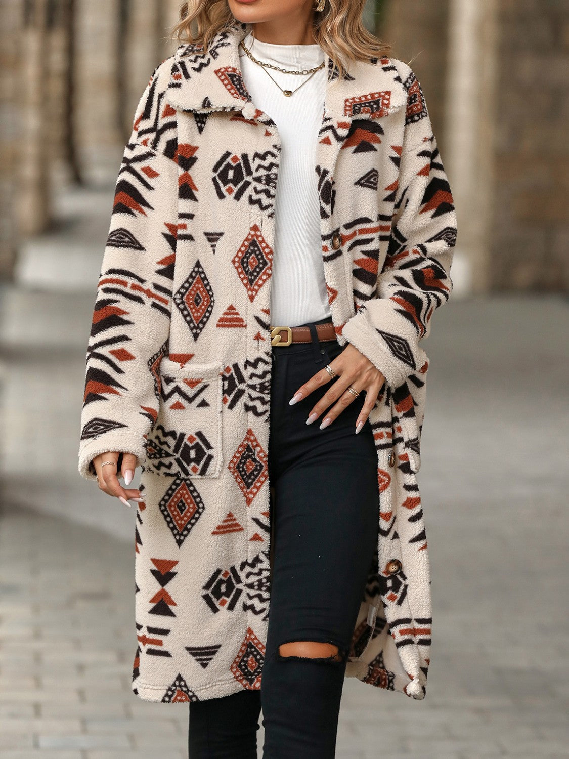 Longline teddy coat with Aztec print in cream, brown, and black, featuring pockets and a relaxed fit.