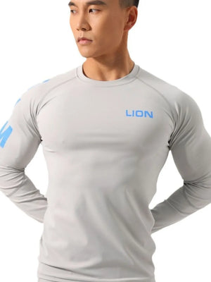 Gray performance raglan sleeve tee with blue logo on chest and sleeve.