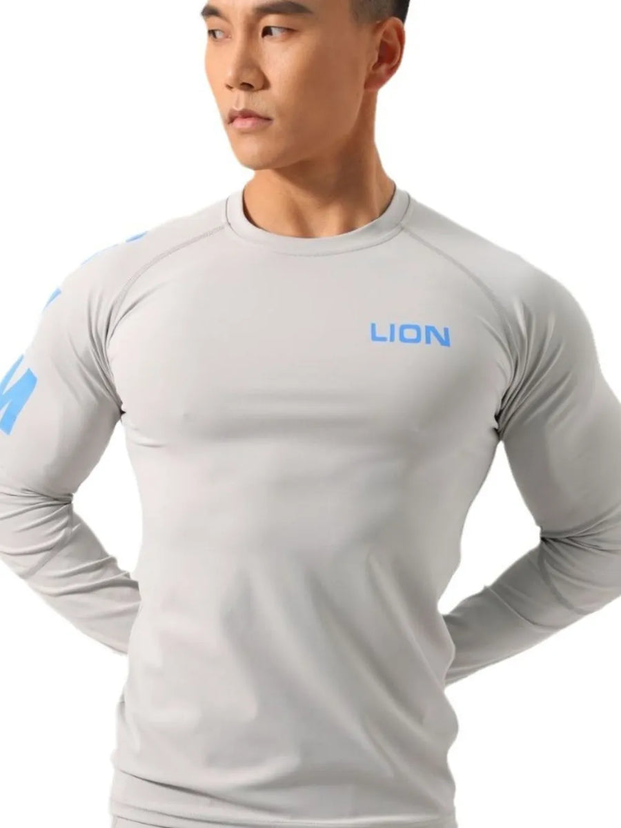 Gray performance raglan sleeve tee with blue logo on chest and sleeve.
