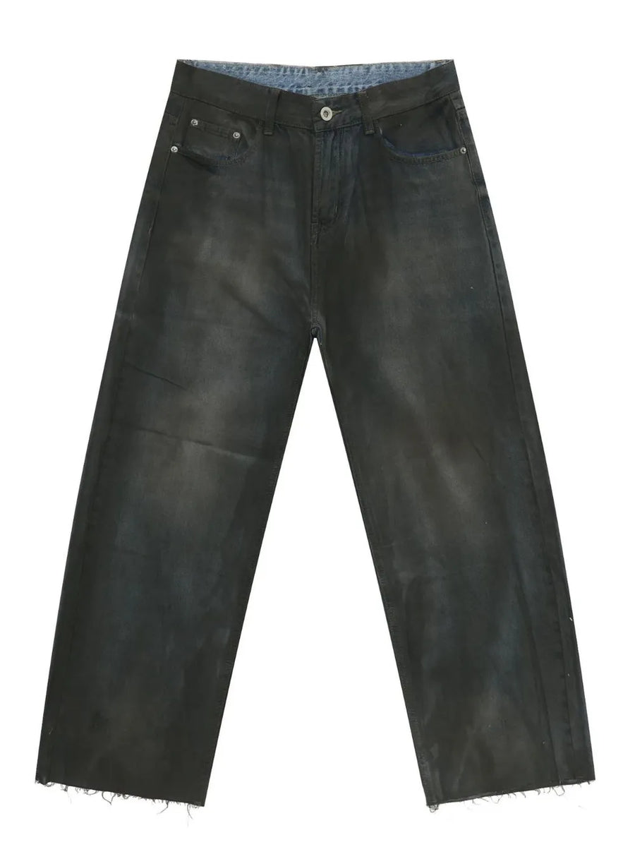 Washed denim wide-leg trousers in dark with a raw hem.