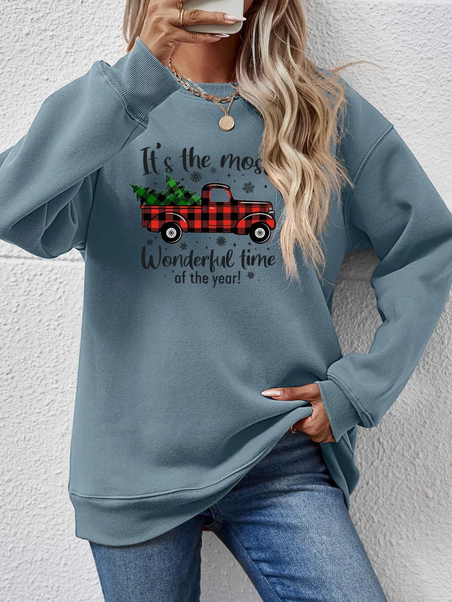 Misty Blue sweatshirt with Christmas truck graphic and text.